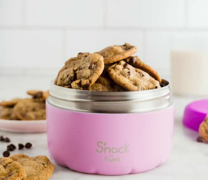 bunch of cookies in pink food container